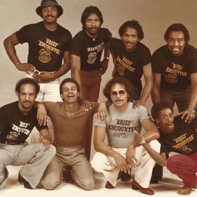 The Brief Encounter — the full group in their 'Brief Encounter' shirts